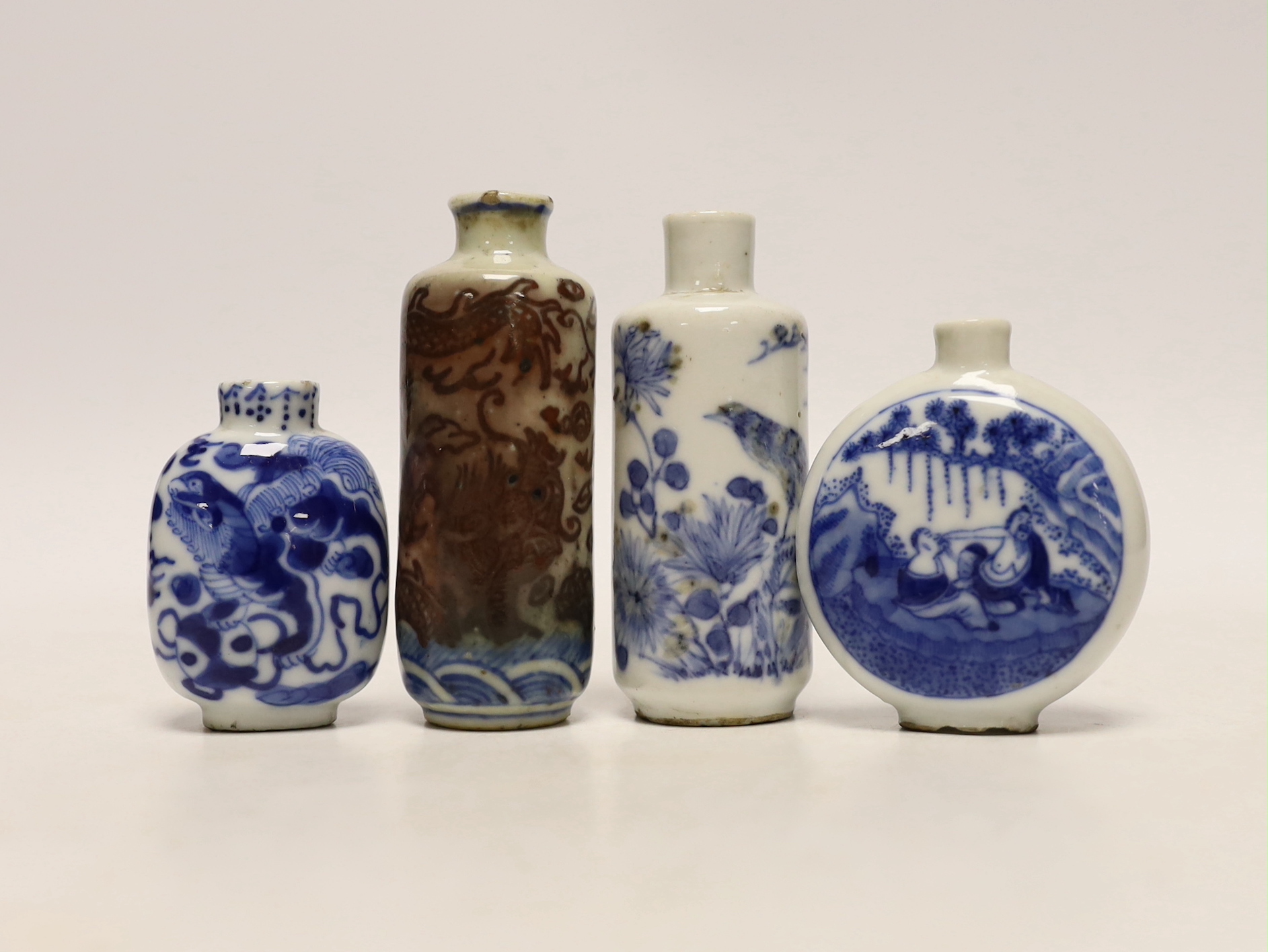 Three 19th century Chinese blue and white snuff bottles, and a similar underglaze blue and copper red Dragon snuff bottle, tallest 8cm